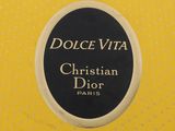 christian dior dolce vita perfume bottle label on a yellow polka dot background