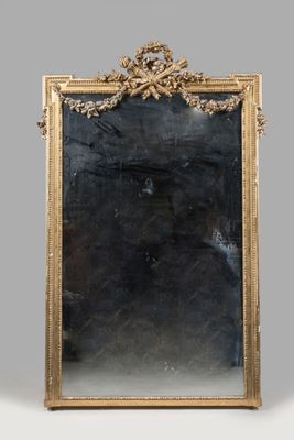 an image of a gold framed mirror on a grey background