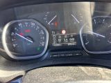 a close up of a car dashboard with a speedometer and gauges