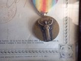 a picture of a medal with a ribbon around it