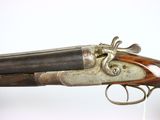 a close up of a gun on a stand with a white background