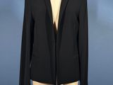 a black jacket with fringes on a mannequin mannequin mannequin mannequin mannequin mannequin mannequin mannequin