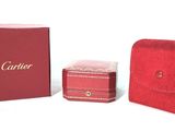 two red boxes and a red case sitting next to each other