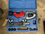 a blue tool box with tools in it on the floor