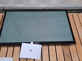 a picture of a glass window on a wooden floor