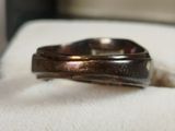 a ring that is sitting on top of a napkin