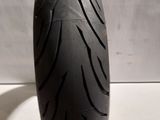a close up of a motorcycle tire on a white surface