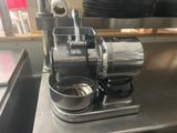 a machine that is sitting on a counter in a kitchen