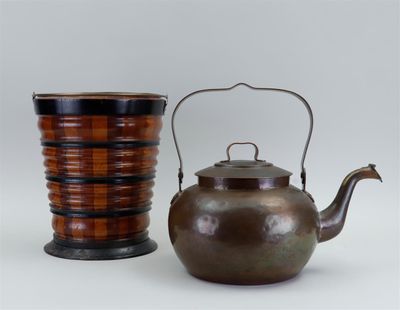 two tea pots and a tea kettle sitting next to each other