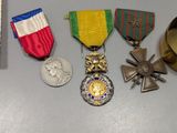 many medals and medals that are on a table