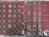 two rows of coins in a plastic case