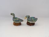 pair of blue and green ducks on wooden bases