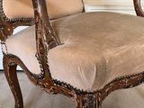 a chair that is sitting on a rug in a room