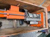 a machine that is sitting on top of a wooden shelf