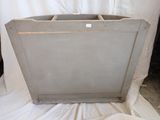 a large metal box sitting on top of a white sheet