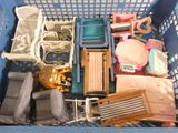 a blue basket filled with toys and a stuffed animal