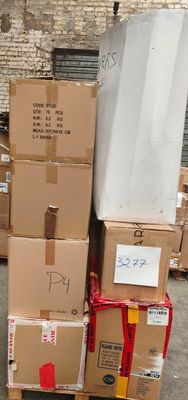 many boxes stacked on top of each other in a warehouse