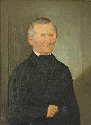 portrait d'un homme vêtu d'un manteau noir et d'une chemise à col blanc
