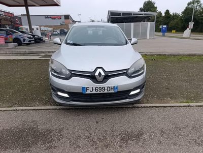 a picture of a silver car parked in a parking lot