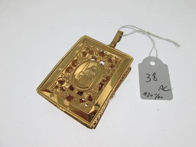a close up of a gold locke with a price tag on it
