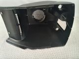 a close up of a speaker in a black box