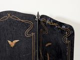 a black and gold screen with a bird on it