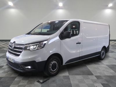 the white van is parked on a checkered tile floor