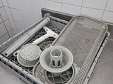 a dirty dishwasher in the middle of a kitchen counter