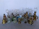 many different types of glass vases on the table