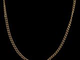 a gold chain on a black background