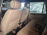 a picture of the inside of a car with leather seats