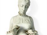 a statue of a woman holding something in her hands