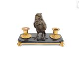 a figurine of a bird sitting on top of a table