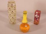 three vases sitting next to each other on a table