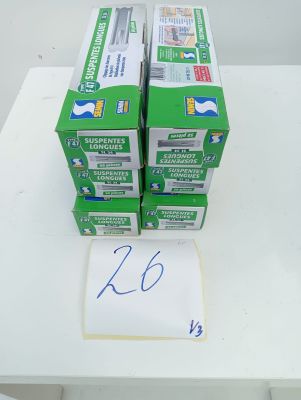 several boxes of toothpaste sitting on top of a white table