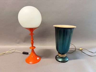 two lamps that are sitting next to each other on a table