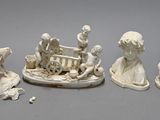 four figurines that are sitting on a table