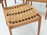 four chairs that are sitting on a white floor