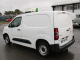 a white van that is parked in a parking lot