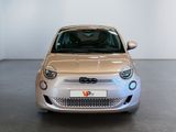 a silver car that is parked in a showroom