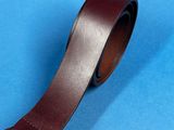 a close up of a brown leather belt with a metal buckle