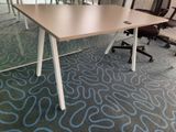 tables and chairs in an office setting with a blue carpet