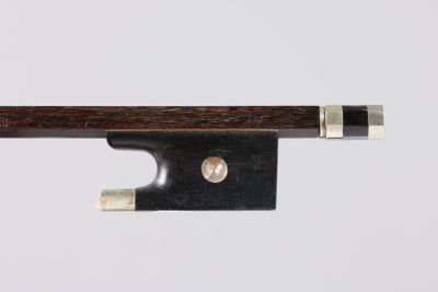 a close up of a violin bow on a white background