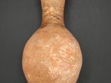 an image of a clay vase on a black surface