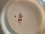 a close up of a plate with writing on it