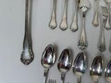a lot of spoons and spoon spoons on the table