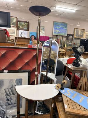 an image of a room filled with furniture and art