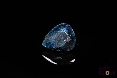 an image of a blue diamond on a black surface