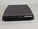 a black laptop sitting on top of a white table