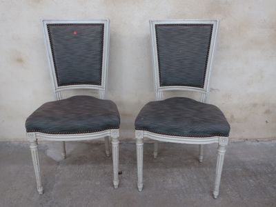 pair of french style dining chairs with black upholstered seats